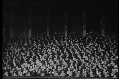 Audience in theater applauding Stock Footage