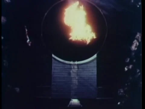 Audience watching acrobat high dive into fire in water tank at carnival Stock Footage 260251324