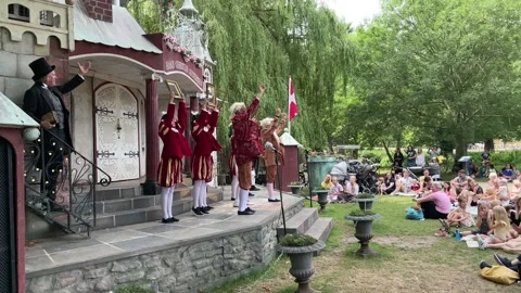 Audience watching H C Andersen show in the Fairy-tale Garden in Odense Centre Video stock 201998572