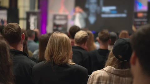 Audience of young professionals observes tech innovation presentation, engaging Video stock 267694316