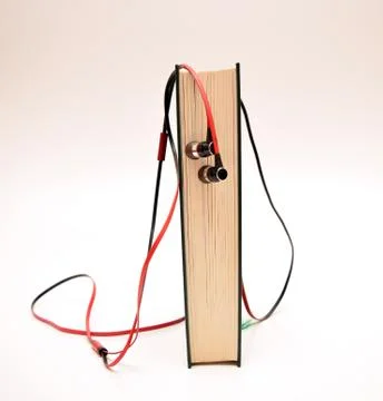 Audio book and earphones Stock Photos