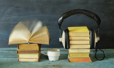Audio book concept with books, blurred pages and headphones,literature,podcast Stock Photos