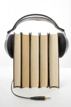 Audio book Stack of hardback books and electronic reader. Electronic library Stock-Fotos