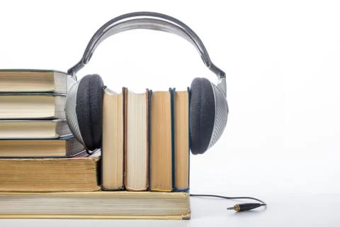 Audio book Stack of hardback books and electronic reader. Electronic library Stock Photos