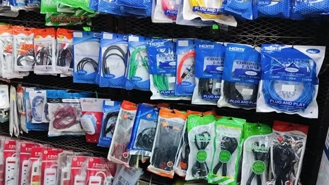 Audio cable color packaging bag hanging on wall Stock Footage 293325768