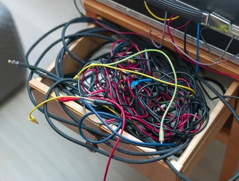 Audio cables inside a cabinet drawer Stock Photos