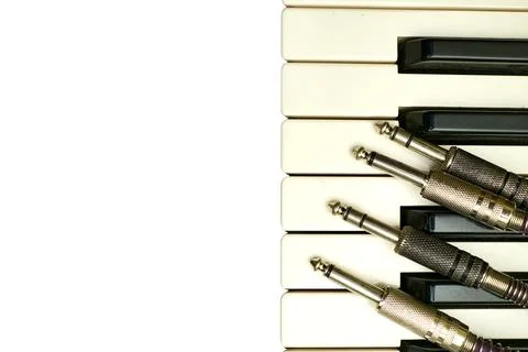 Audio cables with jacks for connection on piano synth keys Stock Photos