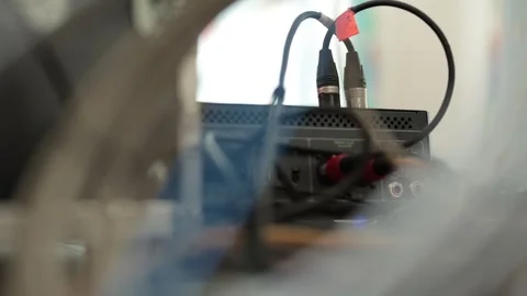 Audio cables with XLR and RCA connectors are plugged into the rear panel of a Stock Footage 341954383