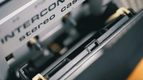 Audio Cassette is inserted into the Deck of the Audio Tape Recorder in Slow Video stock 104164361