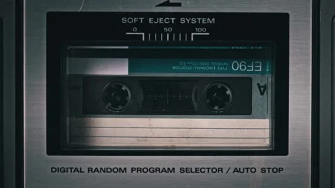 Audio Cassette Rotates in Deck of an Old Tape Recorder Stock Footage 188201298