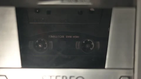 An audio cassette tape in motion Stock Footage 272482676