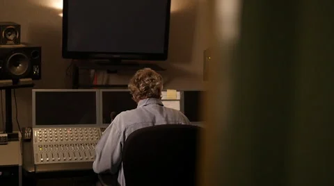 AUDIO EDITOR IN STUDIO WITH DOLLY MOVE Stock Footage 58953008