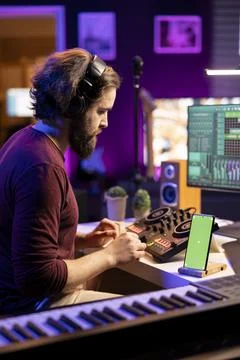 Audio engineer adding sound effects on tunes in post production Fotos de archivo