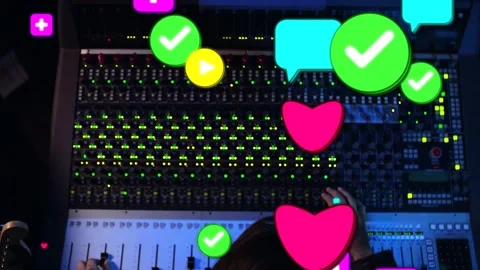 Audio engineer adjusting faders and knobs in studio right hand activating icons Stock Footage 332504494