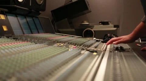 Audio Engineer adjusting knobs on console, low angle 스톡 동영상 49833499