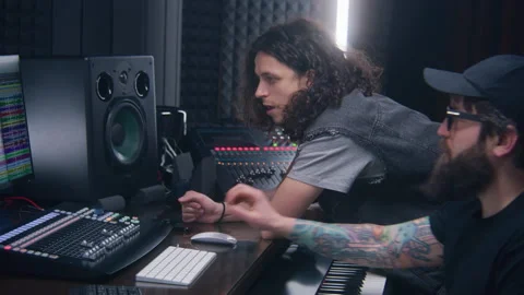 Audio engineer and singer create song on computer 스톡 동영상 238983455