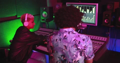 Audio engineer artists working on new music production track list Stock Footage 153404160