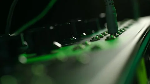 Audio engineer connecting cables to sound mixer Stock Footage 337830942