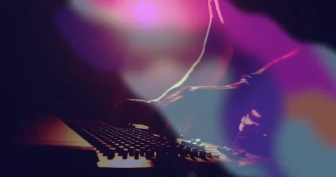 Audio engineer hovering hand above faders sliding mixer fader and twisting knob Stock Footage 313494736
