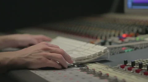 Audio engineer operating mixing console with hands Stock Footage 54462688