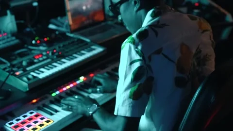 Audio engineer or producer working in a music recording studio with blue LE.. Stock Footage 253152446