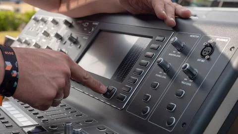 Audio engineer prepping his digital mixer Stock Photos