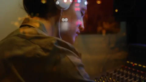 Audio engineer sliding console faders in music studio, showing animated level Stock Footage 312717164