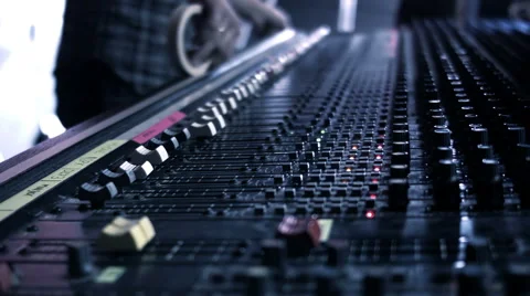 Audio Engineer sticking tape to his mixing console desk. Stock-Footage 52056530
