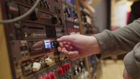 Audio engineer using rack mounted recording equipment Stock Footage 208315377