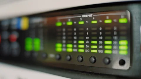 Audio equalizer bars moving on electronic panel, music control levels on desk Stock Footage 111276191