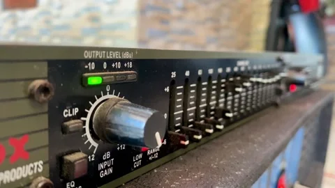 Audio Equalizer Panel with Gain Knob and LED Level Indicators Close-Up Vídeo Stock 332582834