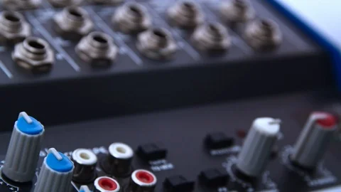Audio gain channel knobs on a professional board mixer, closeup moving shot 動画素材 118859090