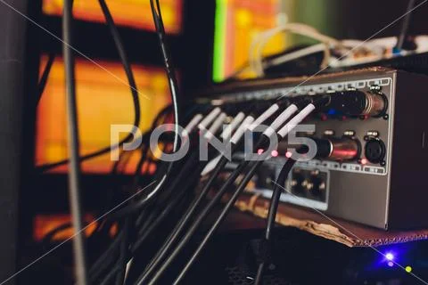 Audio jack cable connected at rear end of mixer at broadcasting,shallow depth of Stock Photos