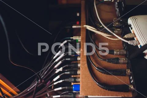 Audio jack cable connected at rear end of mixer at broadcasting,shallow depth of Stock Photos