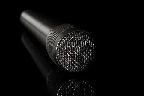 Audio microphone close-up on a black background Stock-Fotos