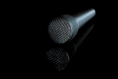 Audio microphone close-up on a black background, copy space Stock Photos