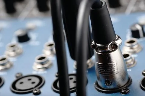 Audio mixer and a cable. Stock Photos