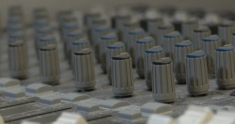 Audio Mixer Board In Recording Studio - Close Up Of knobs Being Used Video stock 103236060