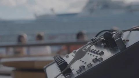 Audio Mixer Console in Outdoor Setting with People and Ship in Sydney, Australia Stock Footage 345728506