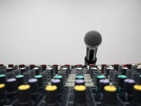 Audio mixer console in studio with microphone Stockfoto's
