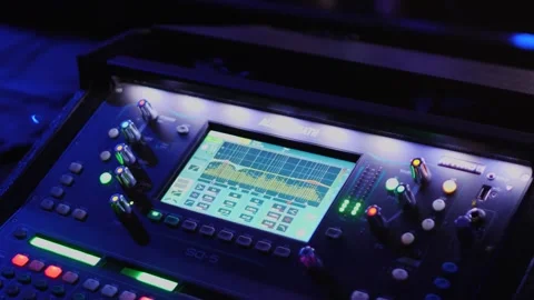 Audio Mixer Engaged in Vibrant Event Atmosphere Stock Footage 331483441