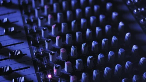 Audio Mixer Knobs in Blue Light Pan Focus Video stock 318482320