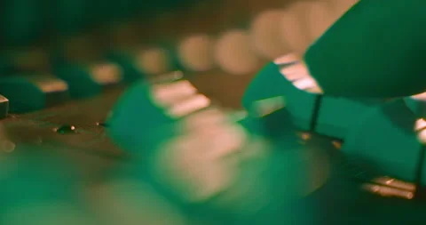 Audio Mixer Macro Close Up. Audio Engineer Lowers Sound Faders. Video stock 167611188
