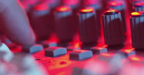 Audio Mixer Macro Close Up. Audio Engineer makes adjustment on Console. Video stock 167611260