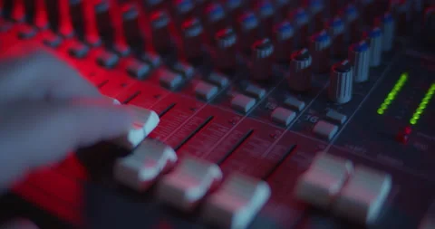 Audio Mixer Macro Close Up. Audio Engineer Pushes Up Master Faders. Stock Footage 167612577