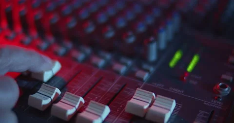 Audio Mixer Macro Close Up. Audio Engineer Pushes Up Channel Fader. Video stock 167612752