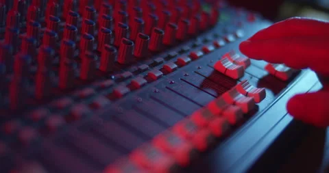Audio Mixer Macro Close Up. Audio Engineer Brings Down Channel Faders. Video stock 167612865