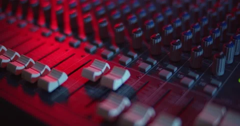 Audio Mixer Macro Close Up. Pan of Mixing Faders and Level Meters. Stock Footage 167612742