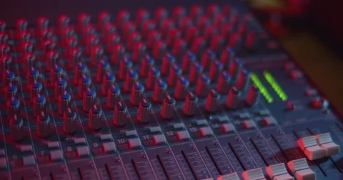 Audio Mixer Macro Close Up. Pan of Mixing Board with Level Meters. Stock Footage