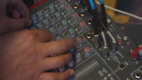 Audio mixer. Remote control for adjusting the sound. Change the volume level. Stock Footage 135538625